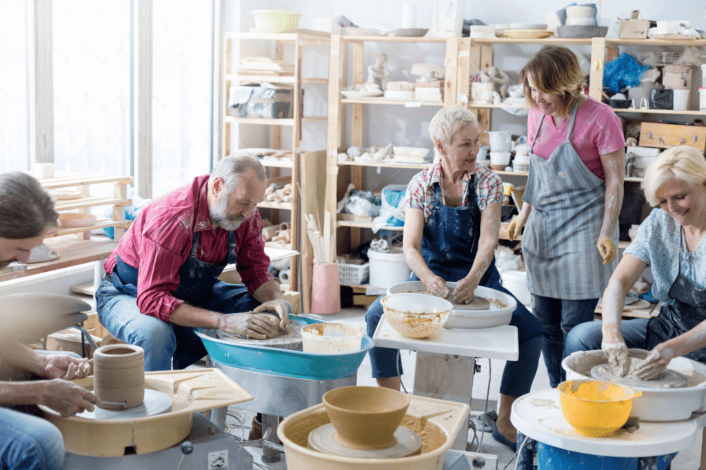 a pottery class with people working with clay