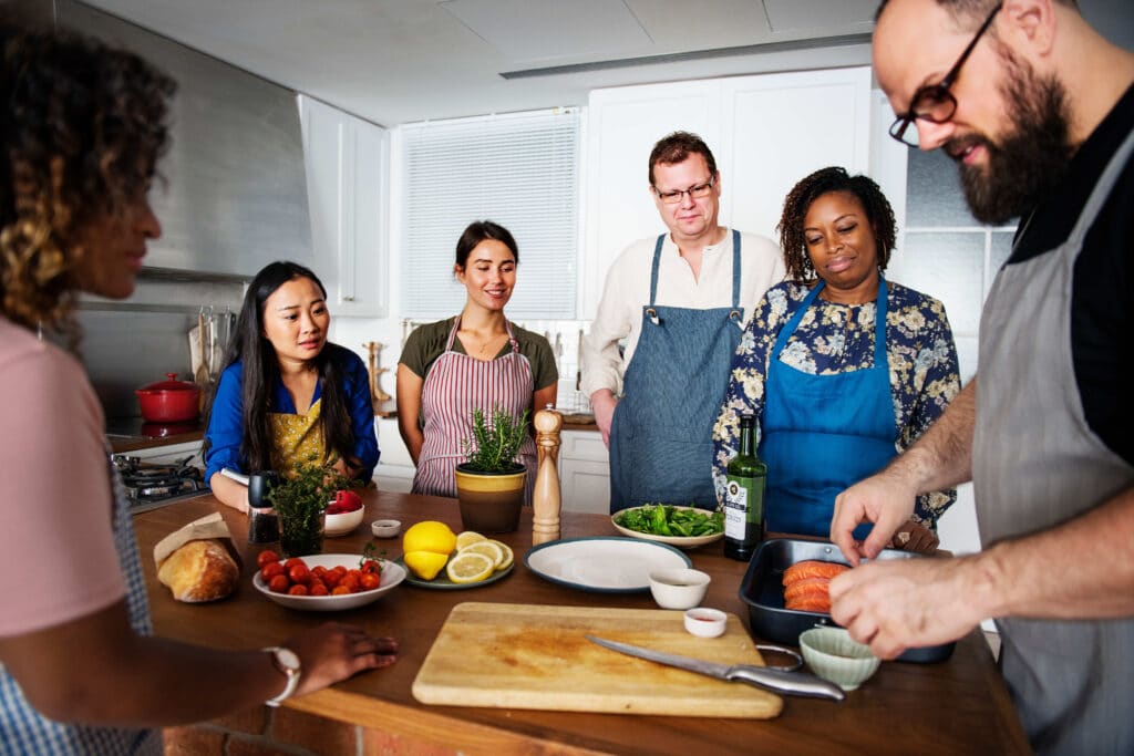 group of people taking a cooking class